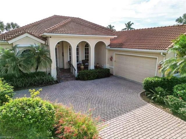 Larhe driveway with side loadgarage