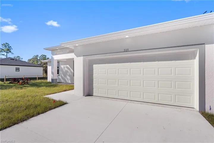 Garage featuring driveway