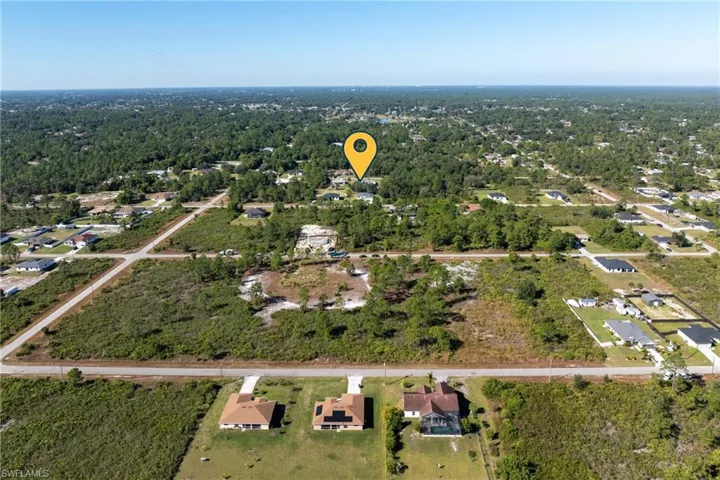 Aerial overview of property's location with nearby suburban area