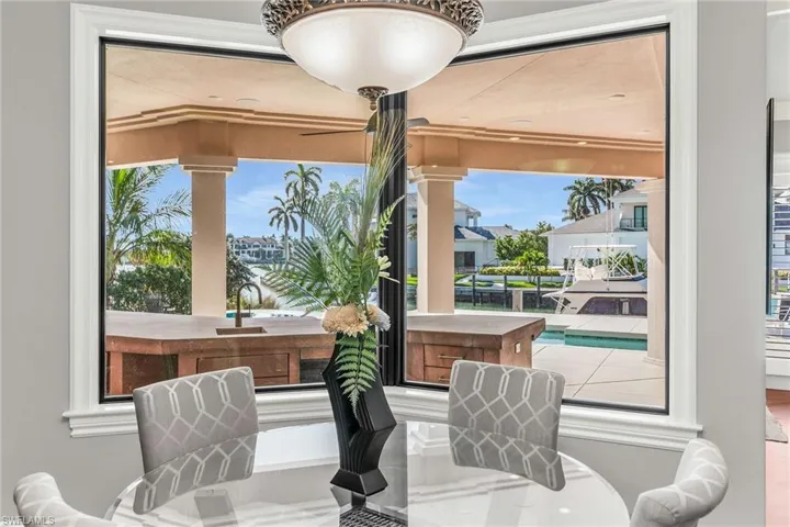 Dining area off kitchen with wrap around window, lovely waterviews.