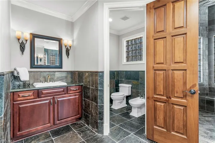 Primary Bathroom dual sinks, separate water closet and bidet.