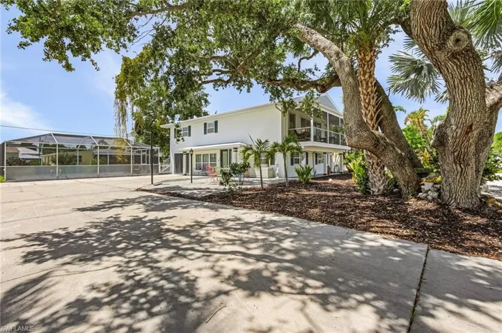 View of front of home with glass enclosure