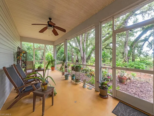 Sunroom with a ceiling fan and healthy amount of natural light