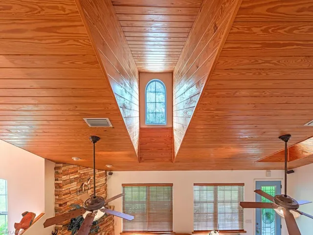 Detailed view of wooden ceiling and a ceiling fan