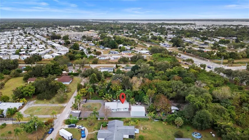 Aerial view of property's location featuring nearby suburban area