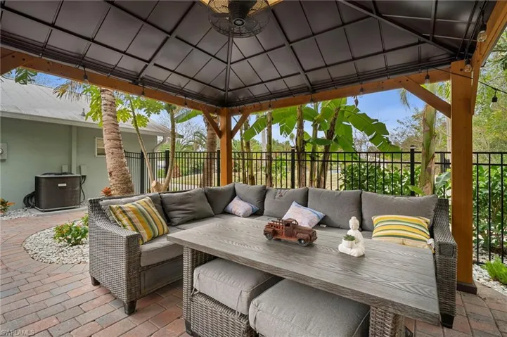 View of patio featuring a gazebo and an outdoor living space