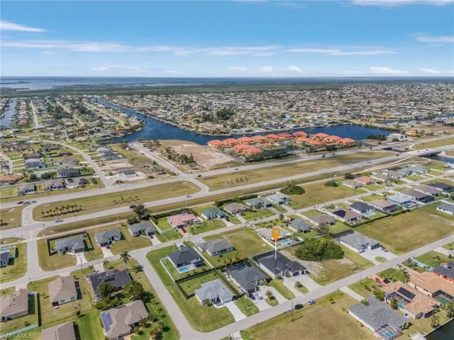 Birds eye view of property featuring a residential view and a water view