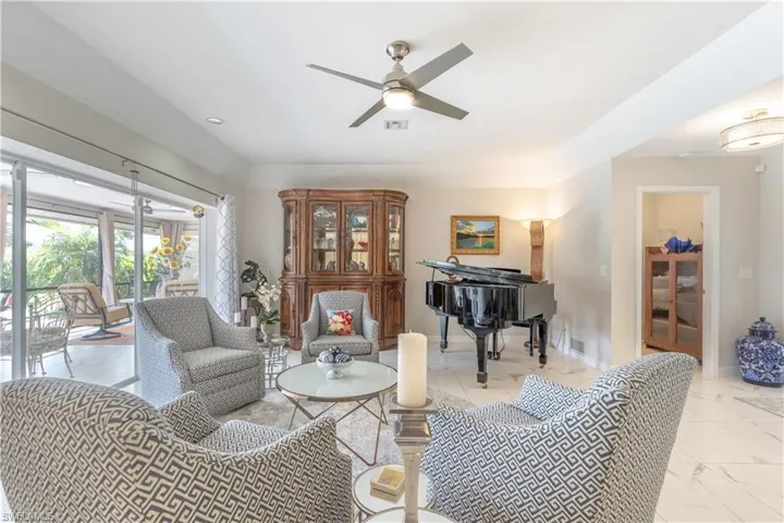 Living room featuring ceiling fan