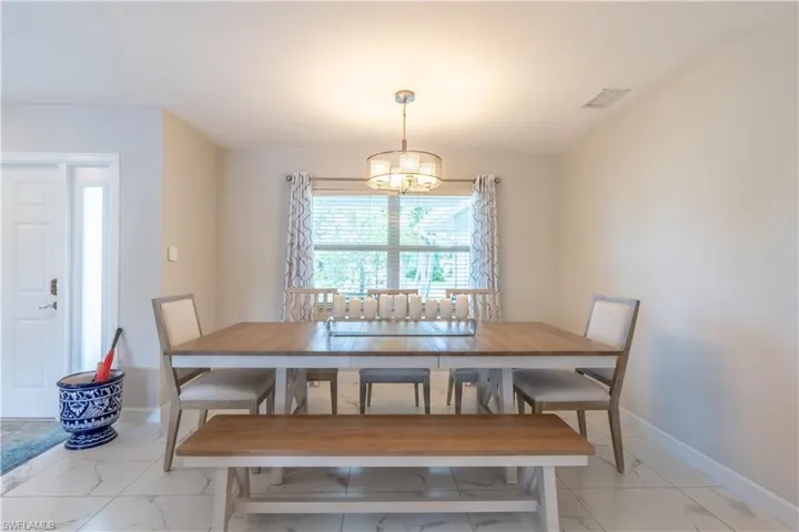 Dining area with a notable chandelier