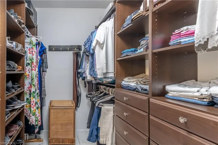 Walk in closet featuring light tile patterned floors