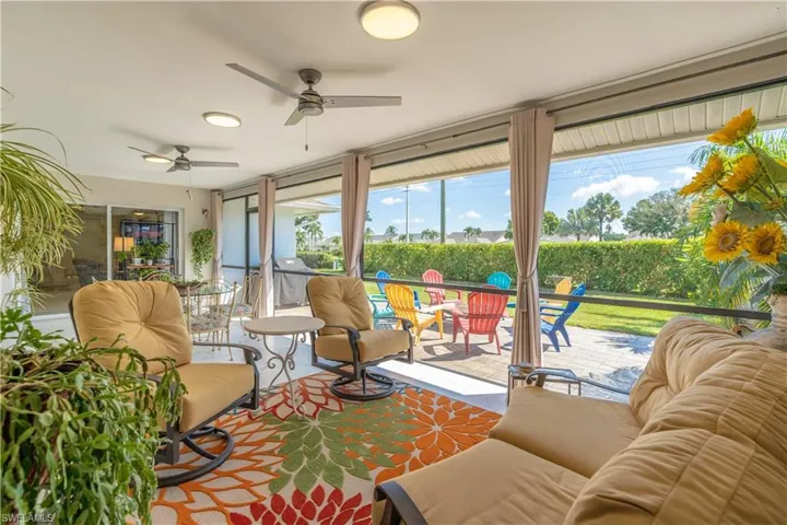 Sunroom featuring ceiling fan