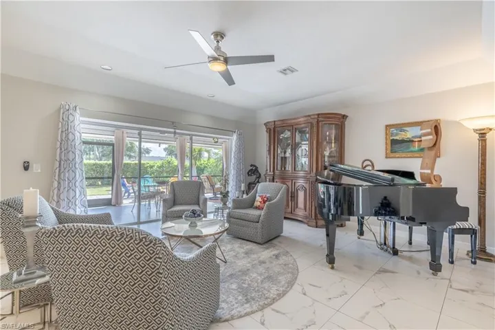 Living room featuring ceiling fan