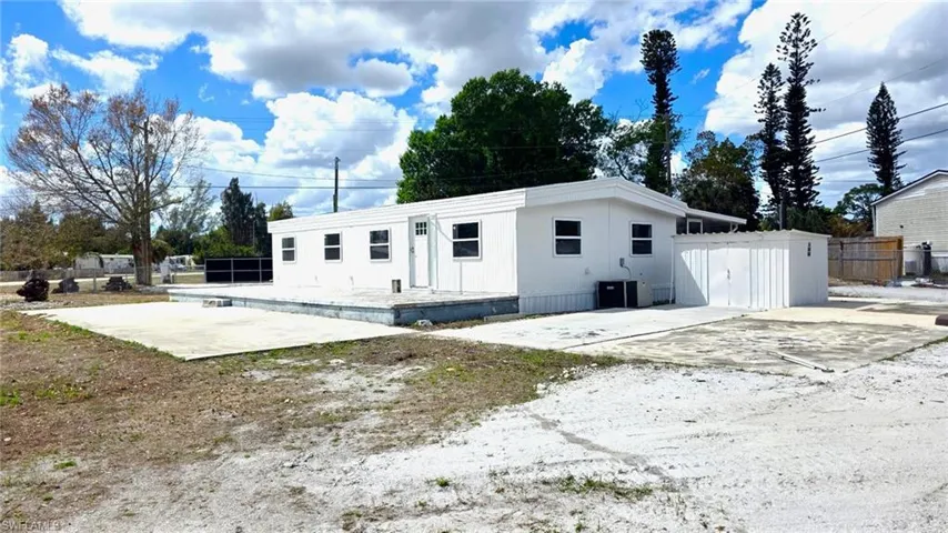 Rear view of property featuring a patio area