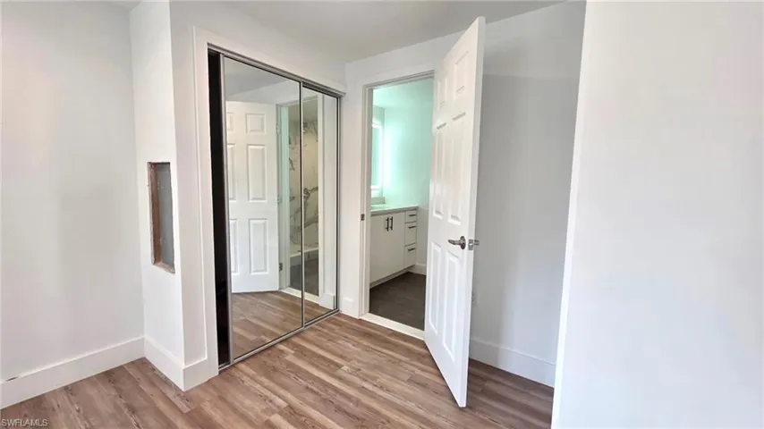 Unfurnished bedroom with a closet and light wood finished floors