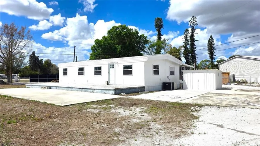 Back of house featuring a patio area and a swimming pool