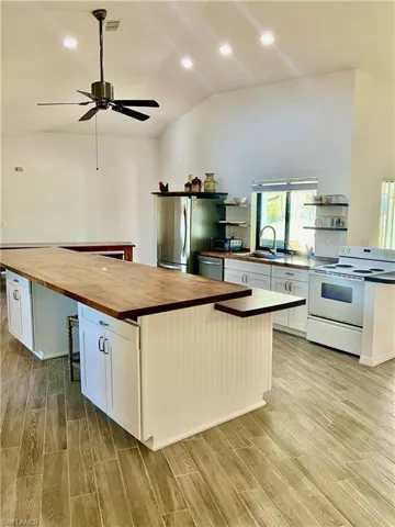 Cabinets on both sides of the island. No need for above counter cabinets