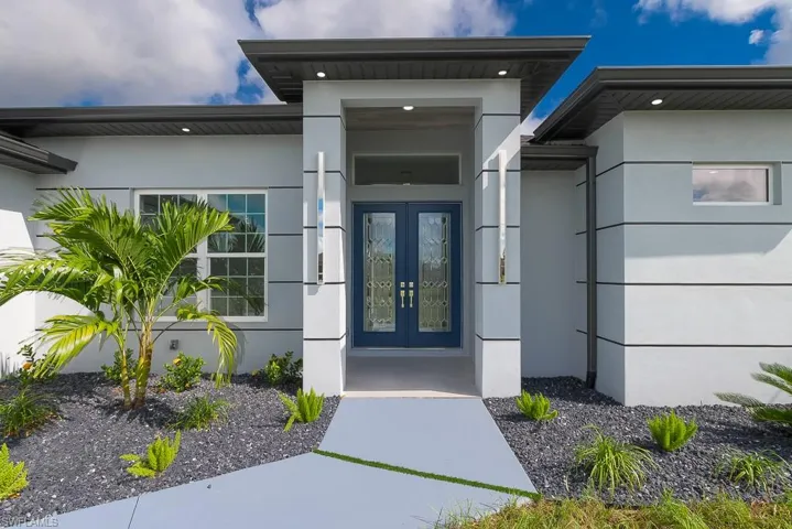 View of exterior entry featuring french doors