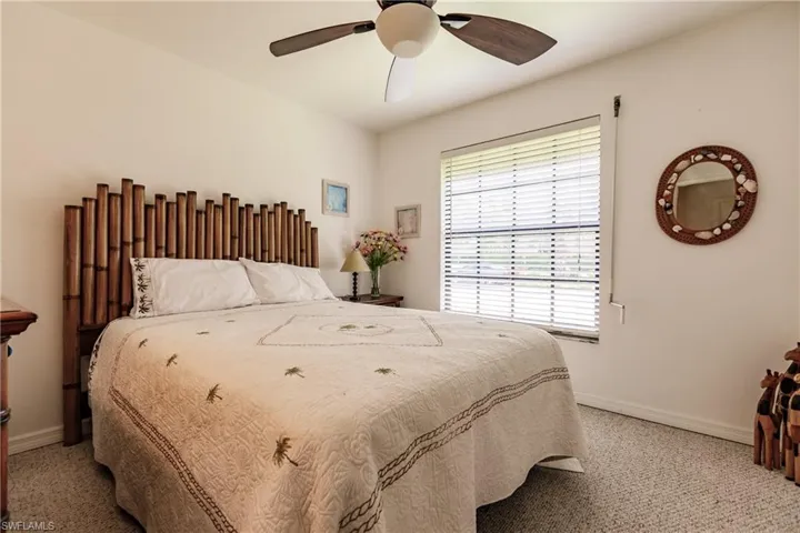 Bedroom with carpet flooring and ceiling fan