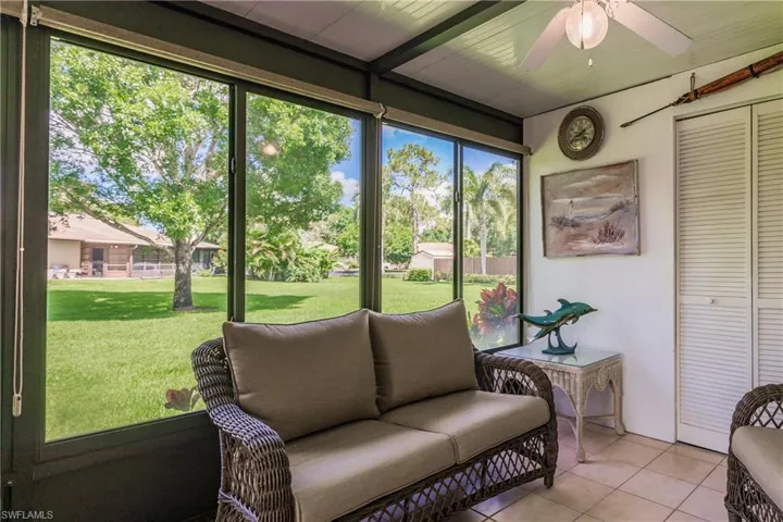 Sunroom featuring ceiling fan