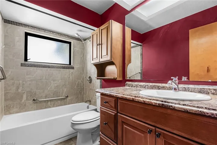 shower is tiles with accent tiles