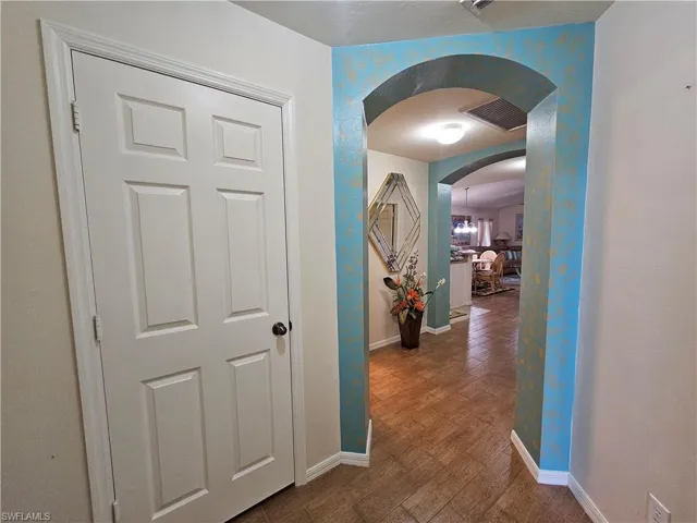 Archways with decorative painting introducing interior spaces