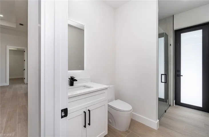 Bathroom featuring toilet and vanity