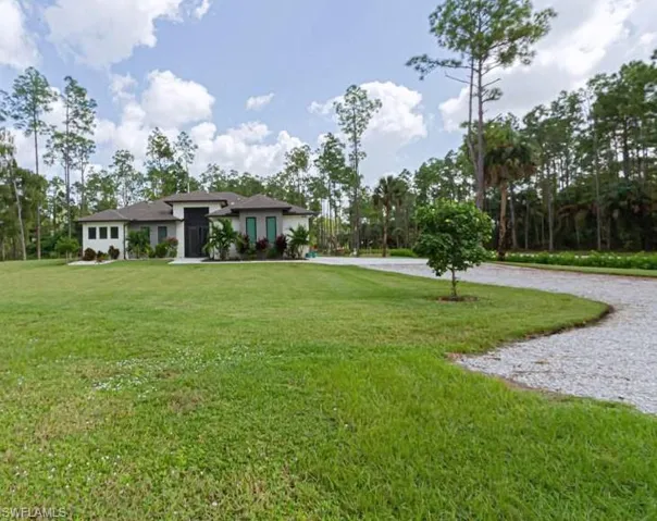 View of front of property with a front yard