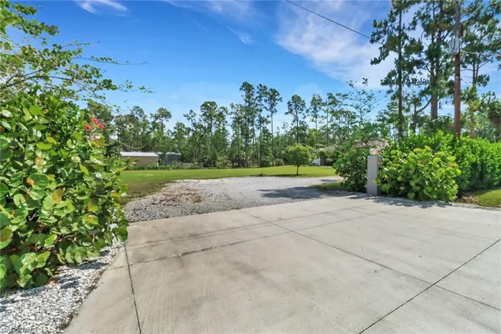 Wide driveway entry for larger vehicles and RVs.