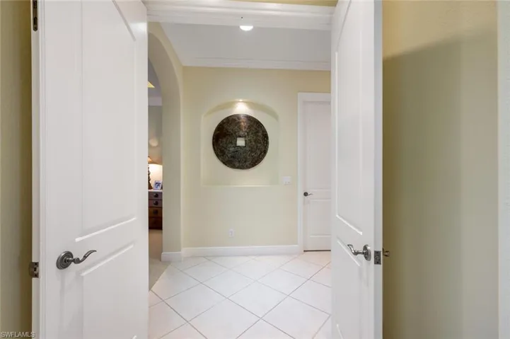 Entry way to the Primary Bedroom off the living room with French doors