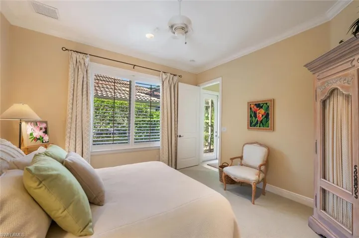 Guest bedroom 2 with close access to the 3rd bathroom and lanai access. Very private away from the great room