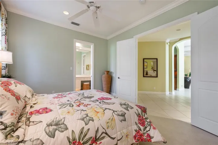 Guest bedroom with French doors away from the main living area