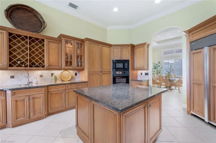 Wet sink, built in wine rack, Paneled Refrigerator, close access to the formal dining room.