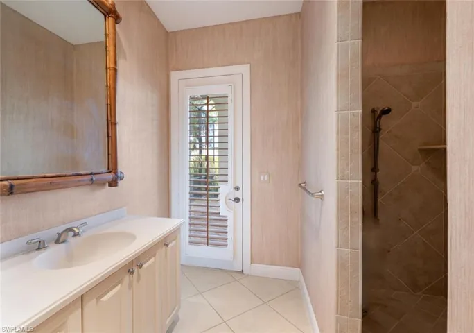 Guest bathroom with walk in tile shower