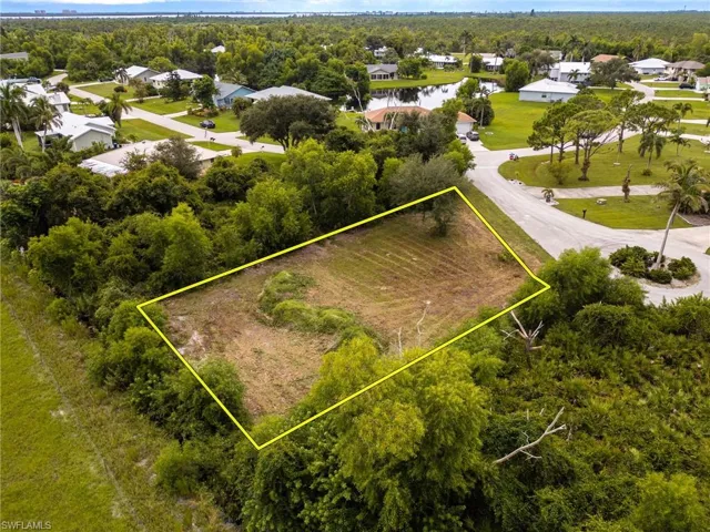 Aerial perspective of suburban area featuring property parcel outlined