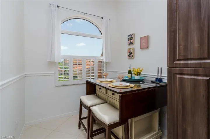 Dining room featuring baseboards and light tile patterned floors