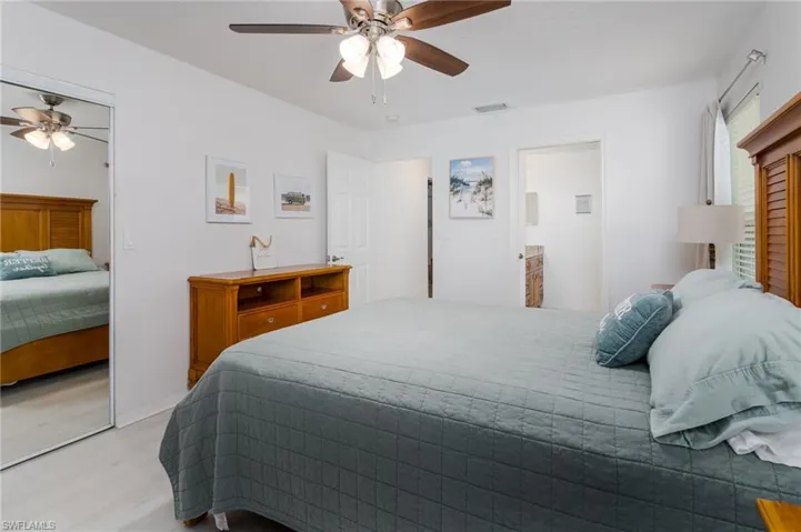 Bedroom featuring light wood-type flooring and a ceiling fan