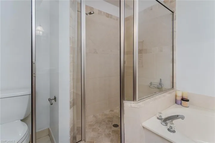 Full bath featuring a garden tub and a shower stall