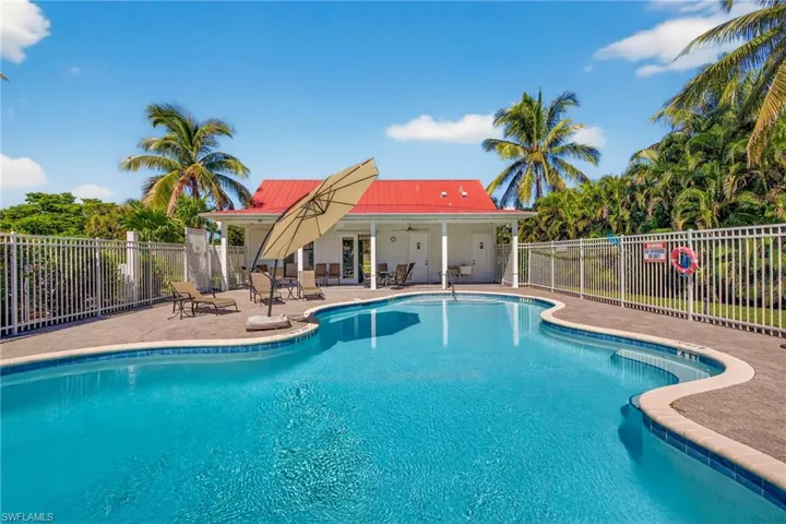 Community pool featuring a patio and ceiling fan