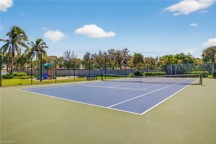 View of tennis court featuring community basketball court