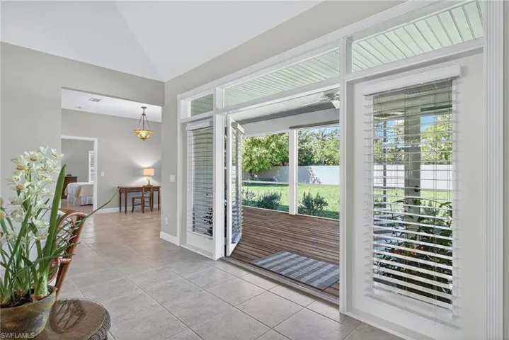 Entryway with tile patterned floors and healthy amount of natural light