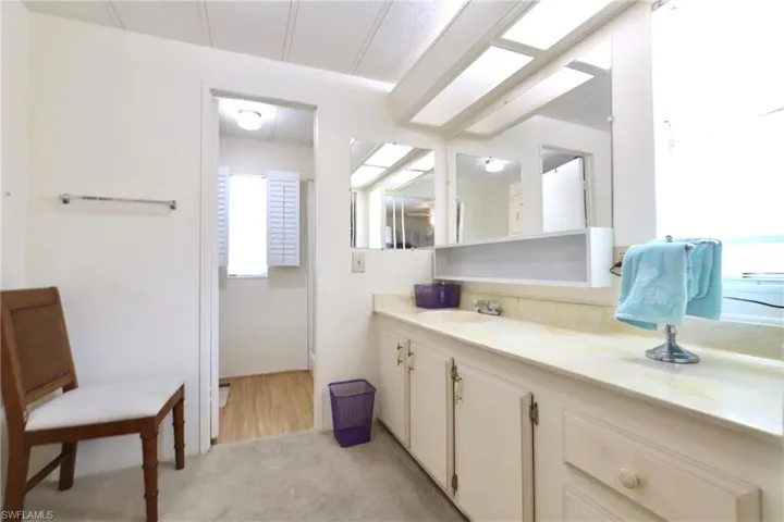 Bathroom with vanity and hardwood / wood-style flooring