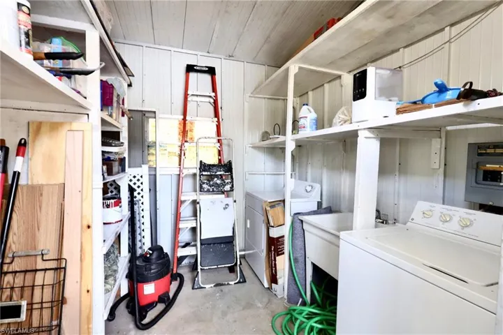 Washroom featuring washer / dryer