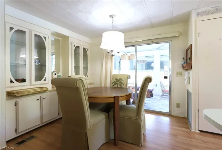 Dining room with light hardwood / wood-style floors