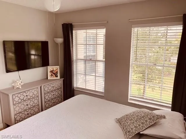 Bedroom with a textured ceiling