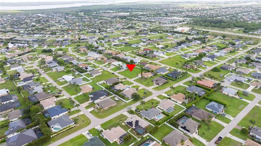 Aerial overview of property's location featuring nearby suburban area