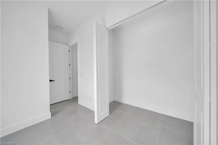 Bathroom featuring baseboards and tile patterned flooring