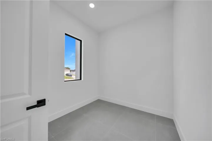 Unfurnished room featuring tile patterned flooring and recessed lighting