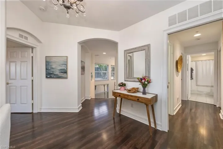 Great transition space with open arched walkways into the laundry and guest suite offering privacy to visitors.
