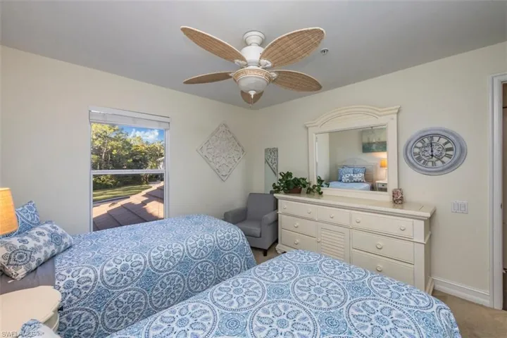 Lovely private preserve views from this second floor guest bedroom with  bathtub perfect for soaking after a day at the beach or rinsing off sand from little feet when the grandkids visit.