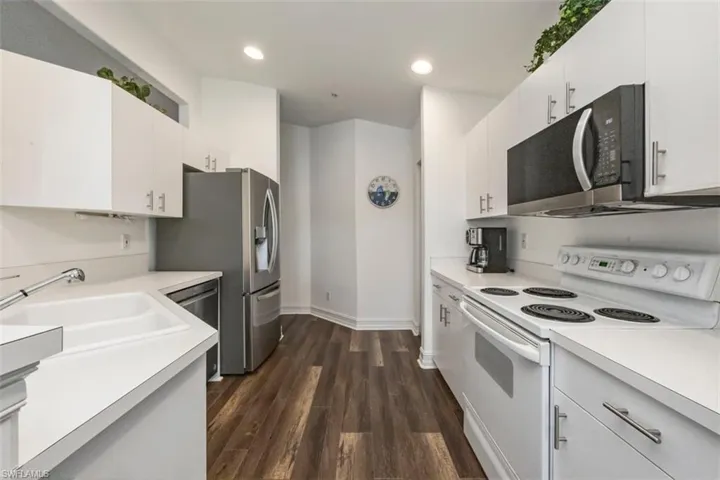 Kitchen featuring new stainless steel appliances.